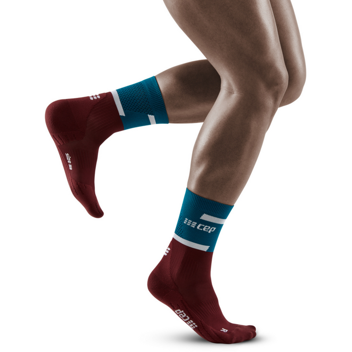 The run calcetines de compresión de corte medio 4.0, hombres, petróleo/rojo oscuro