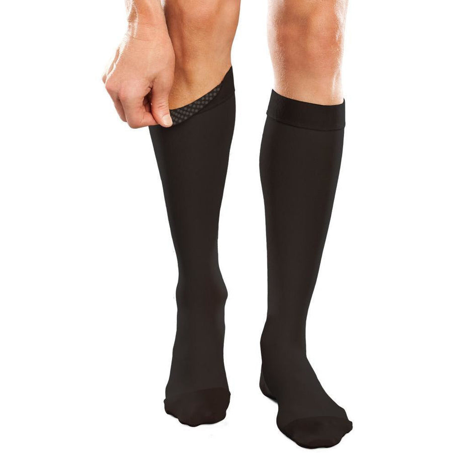Therafirm Ease 20-30 mmHg na altura do joelho com faixa de silicone, preta